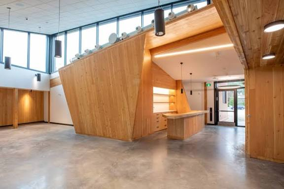 The Confluence building's timber lobby and reception area in Castlegar, BC